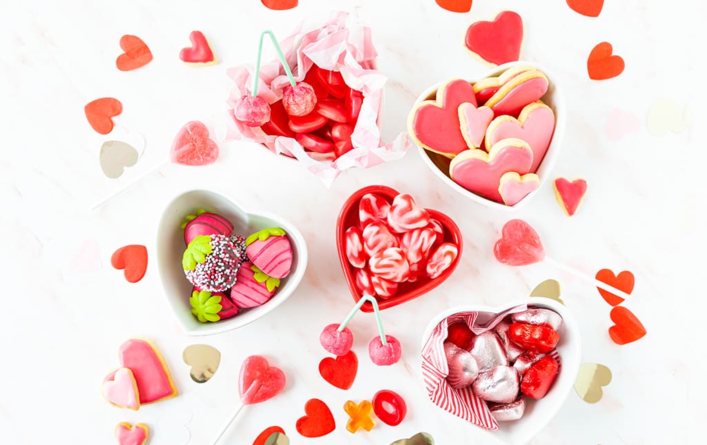 Valentine's day candy prepared in cups and gift bags.