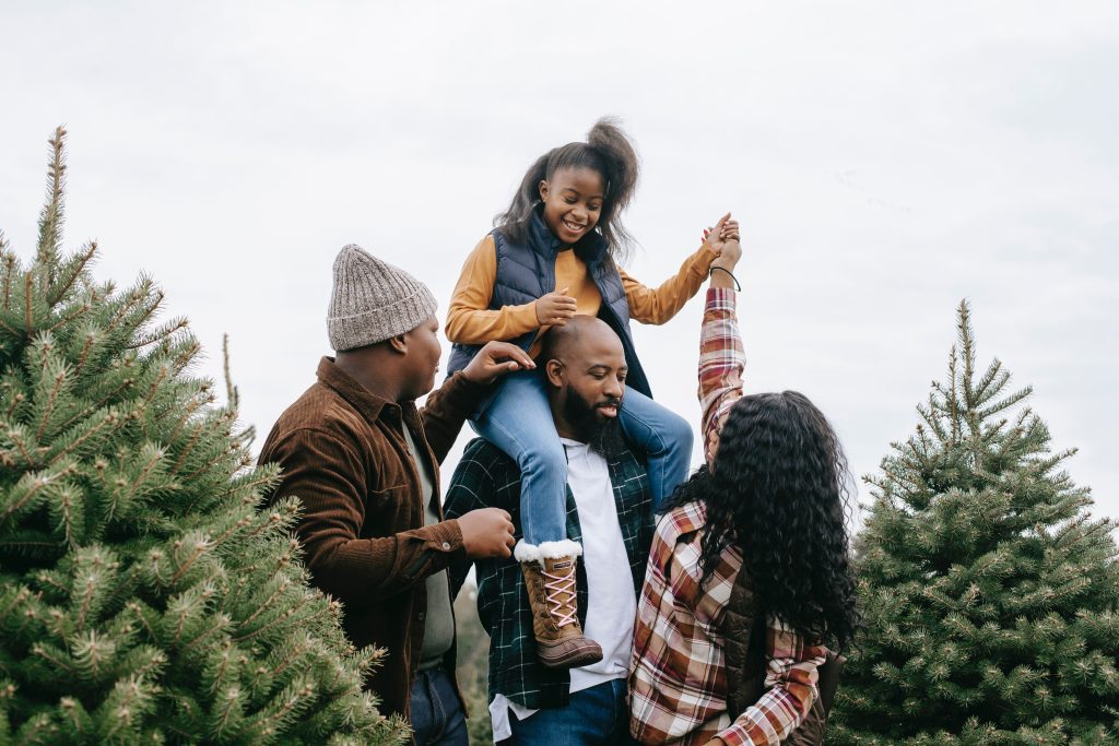 Family picking out a christmas tree