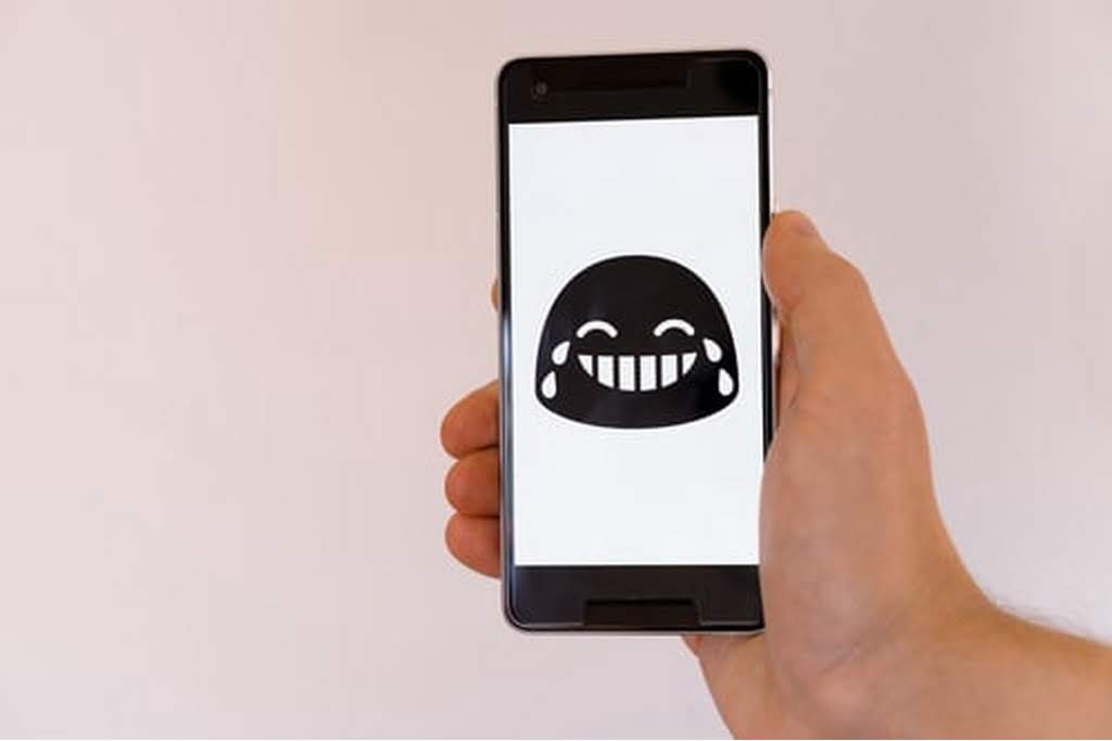 laughing emoji on a phone