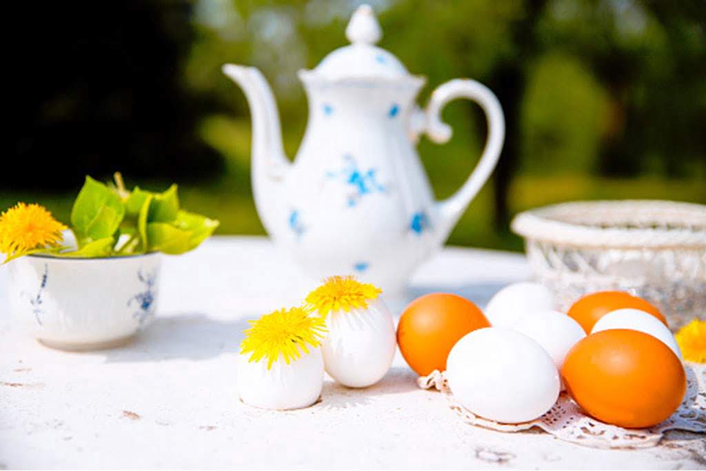 teacup on table with easter eggs
