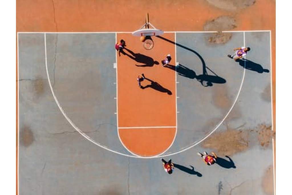 kids playing on a basketball court