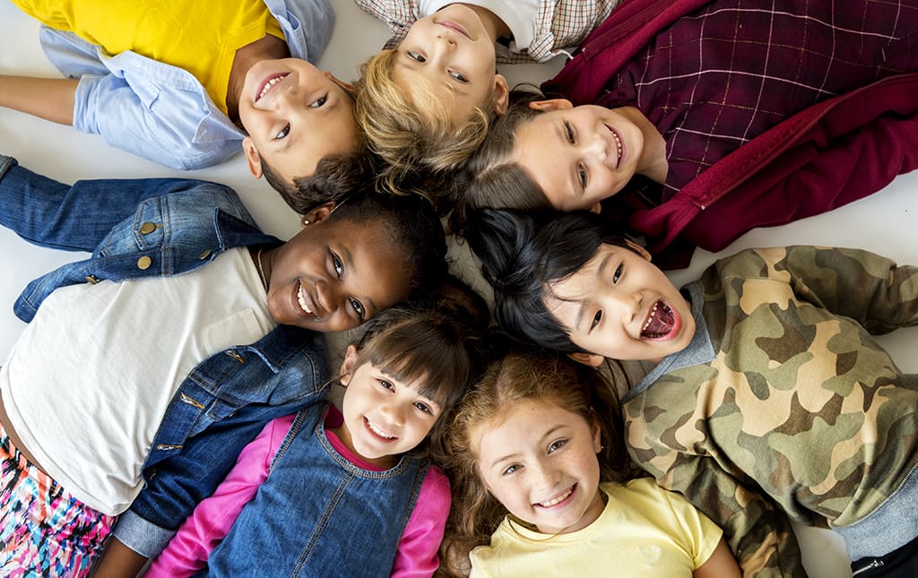Cute kids huddle for a picture during a school fundraiser event.