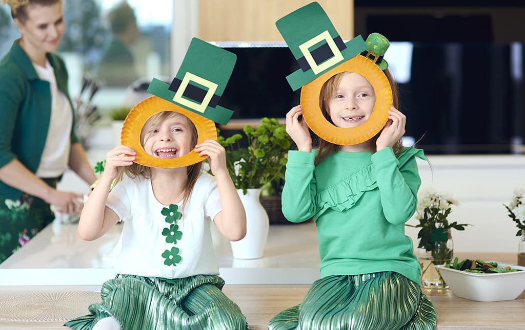 Kids wearing silly Saint Patrick's Day costumes during a school fundraiser