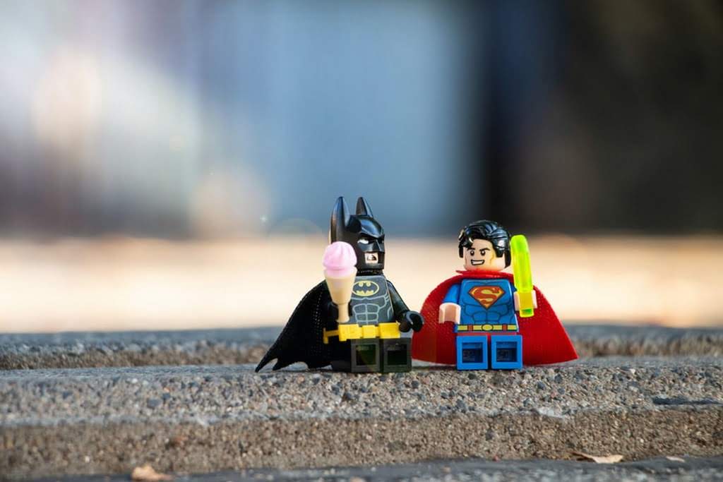 A LEGO Batman with a LEGO superman
