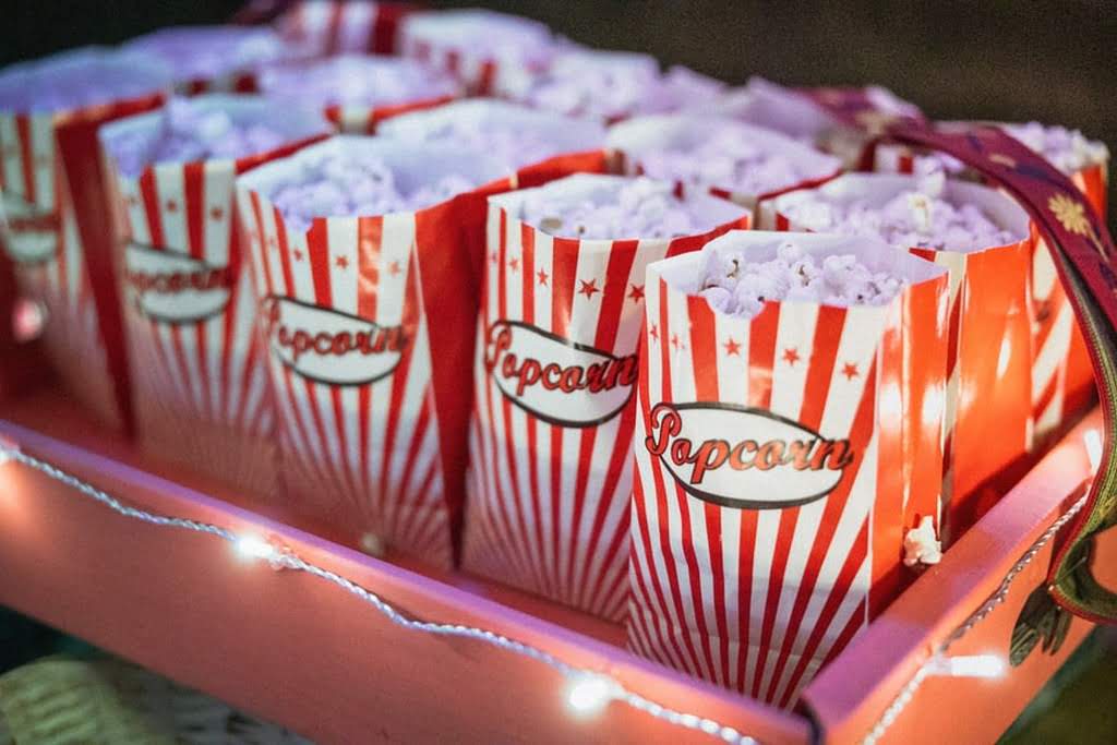 A tray of red and white popcorn bags