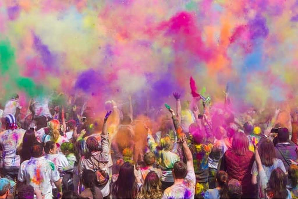 group of people with color paint