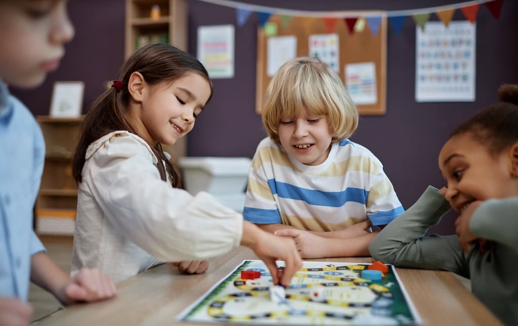 School kids playing a board game during a board game-a-thon