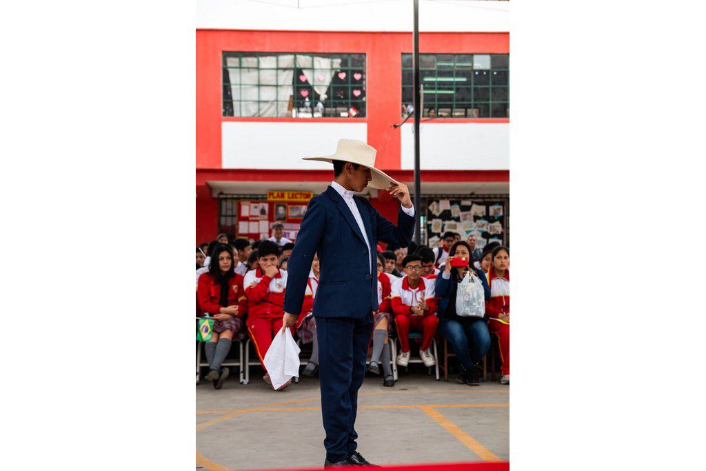 man in a cowboy hat addressing the crowd