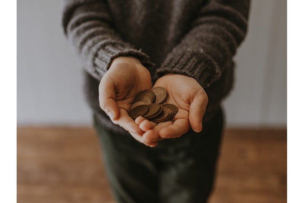 coins in a kids hands