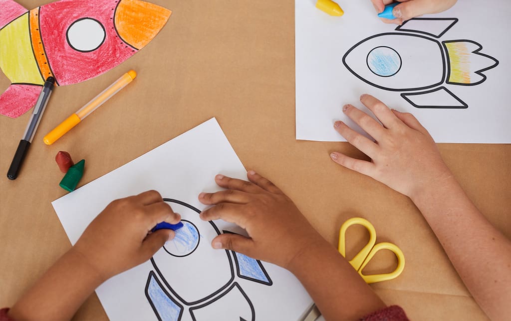 Pre-school student doing arts and crafts