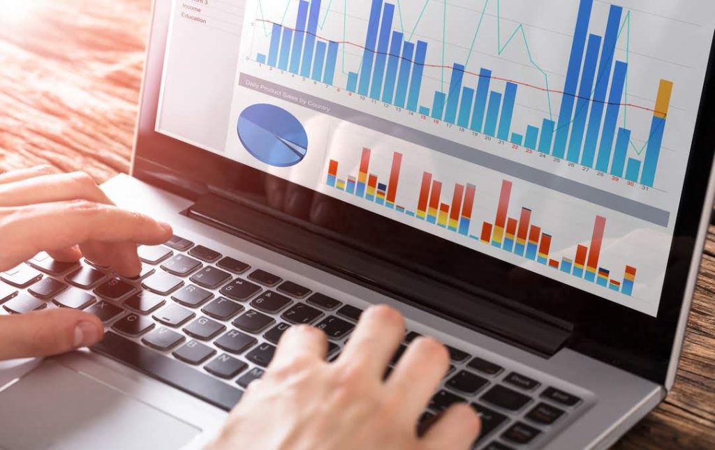 man checking bar graphs