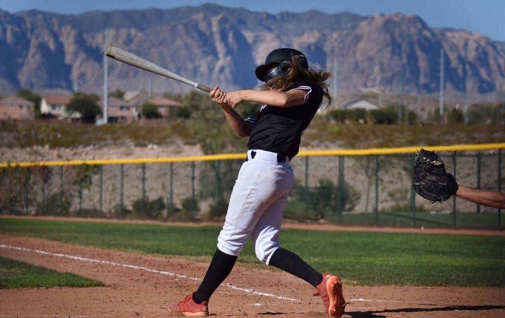 A student hits a home run during a hit-a-thon