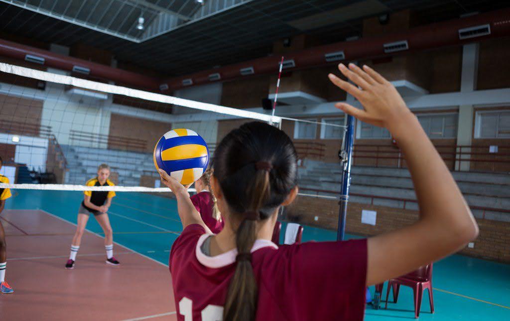Students team up to play volleyball during a serve-a-thon
