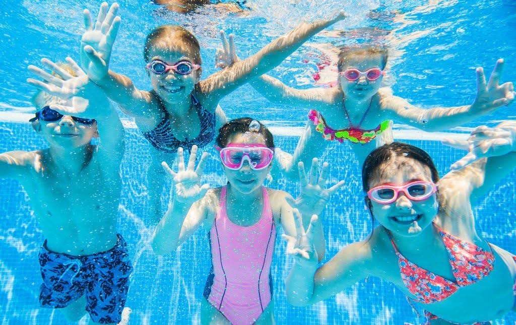Students snap a picture underwater at a swim-a-thon