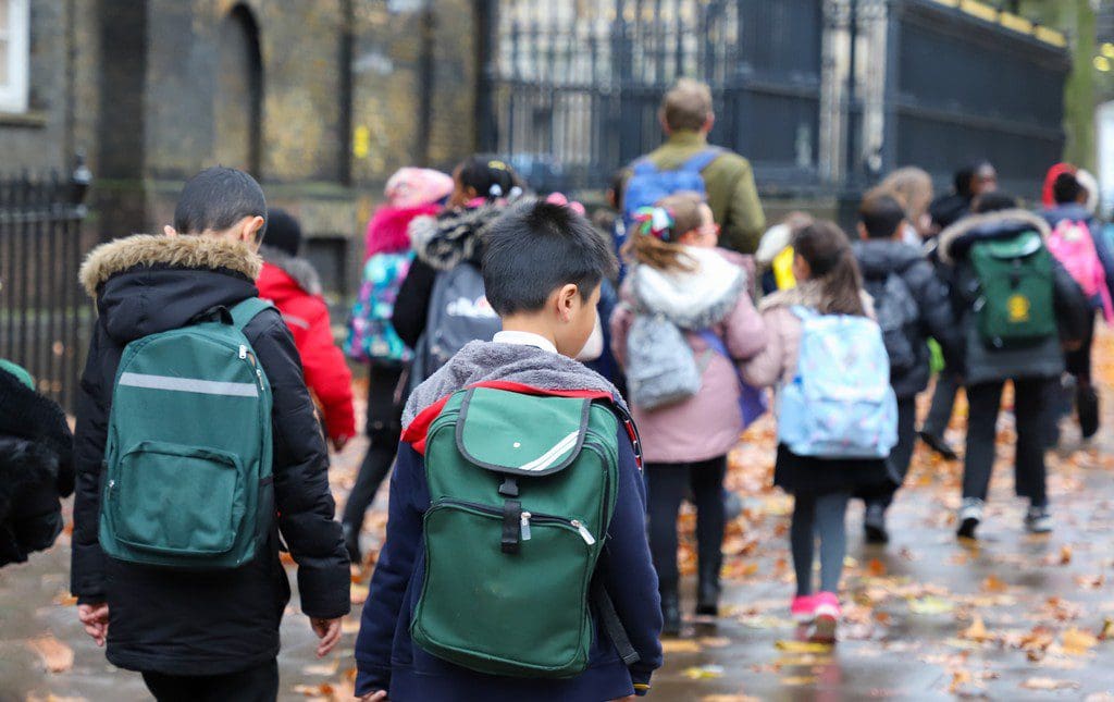 Kids walking on school grounds during a walk-a-thon