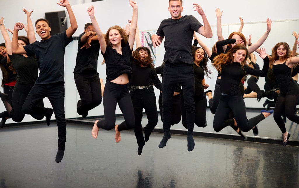 Teens dancing during a dance-a-thon at school