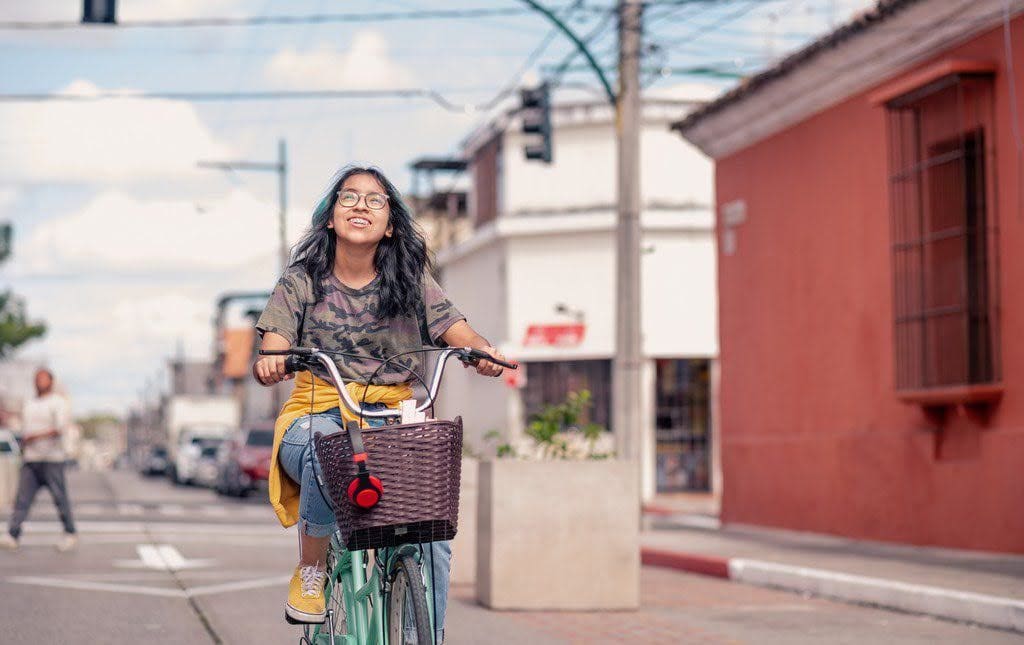 A teenage student biking during a bike-a-thon
