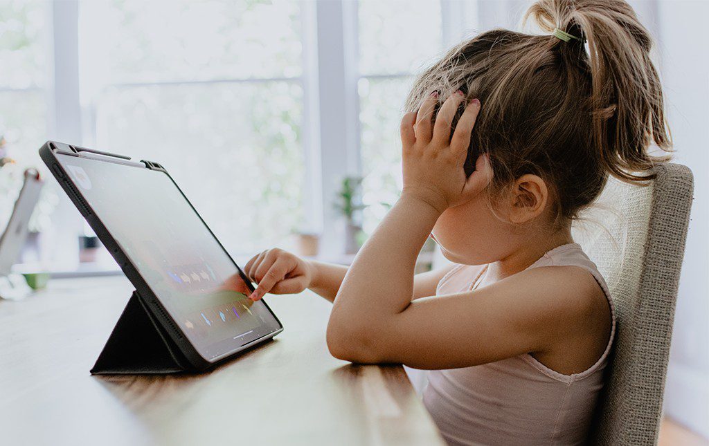 Child reading an tablet