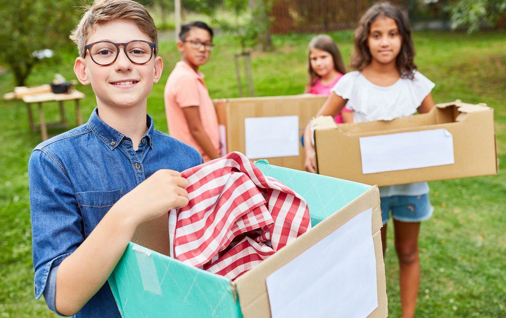 Students with boxes of items for purchase product fundraiser campaign