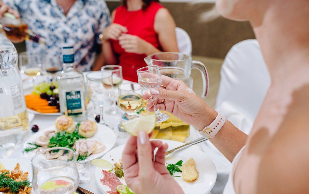 Guests at a fundraiser enjoying schnapps