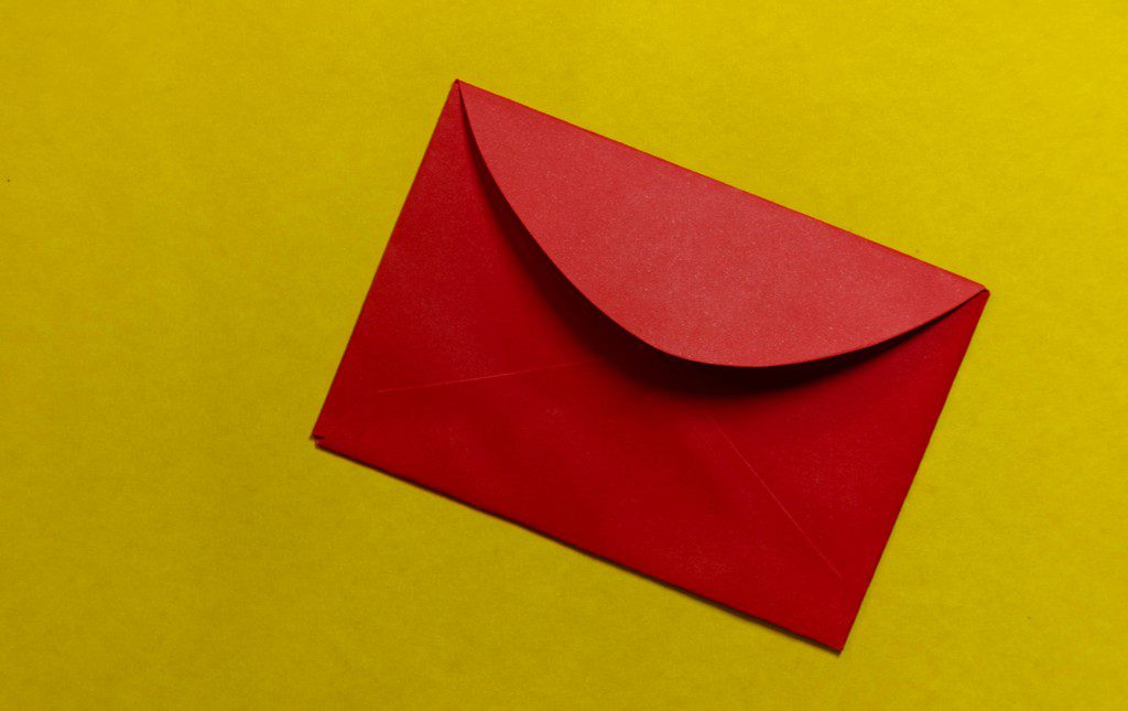 Red envelope on yellow background to symbolize Envelope Fundraiser