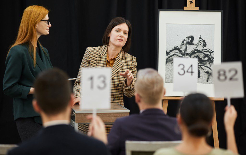 Woman running an auction