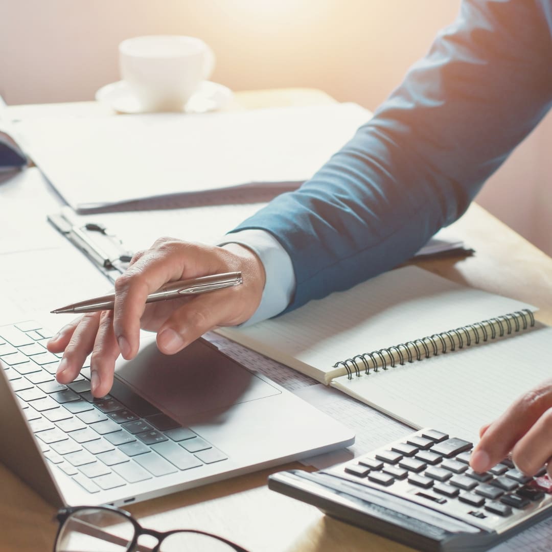 futurefund-budget person at a computer with a calculator