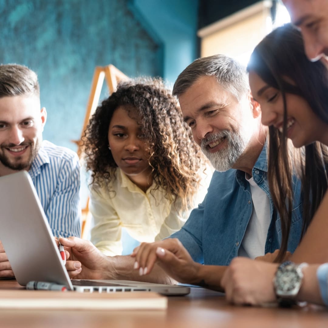 group collaborating over a computer