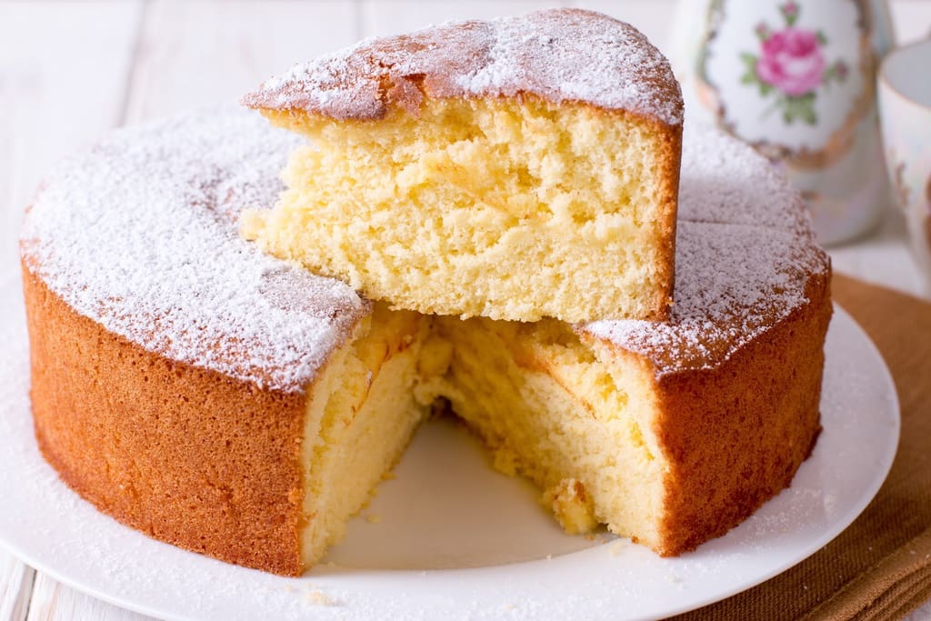 Cake displayed on plate at in-person cake sale fundraiser event