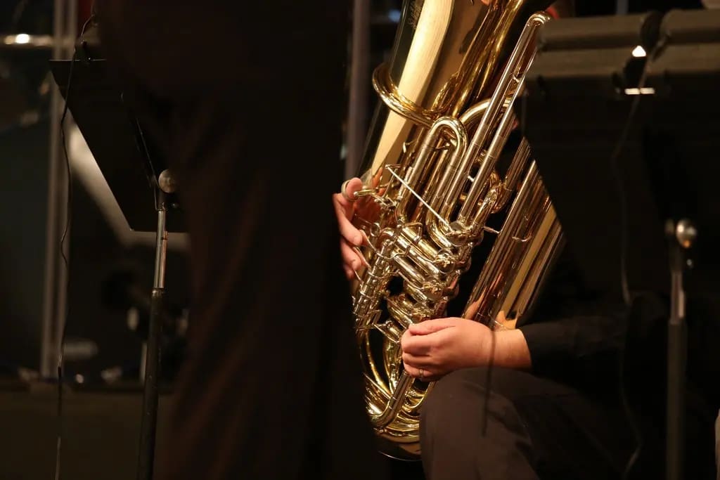 School band member playing tuba as part of live movie music night fundraiser