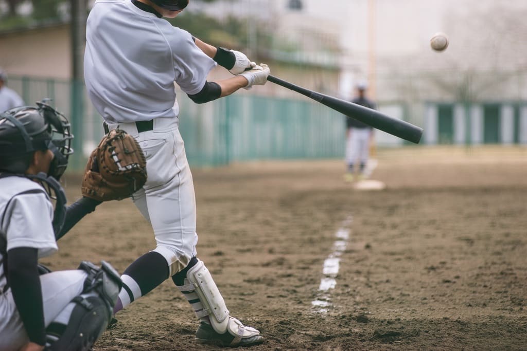 Students hitting baseballs for baseball-hit-a-thon summer fundraising campaign