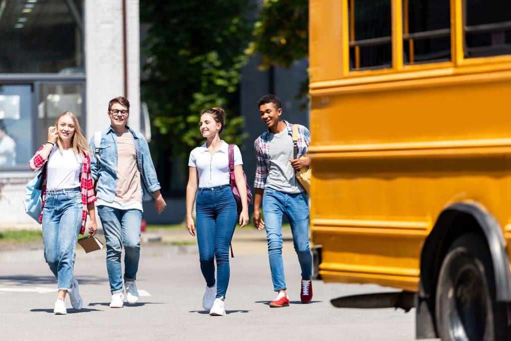 High school students on way to clean and decorate school bus