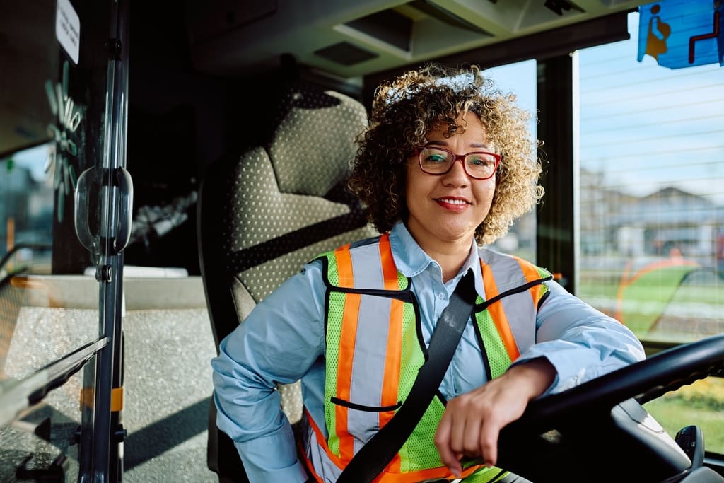 Smiling school bus driver for school newsletter feature